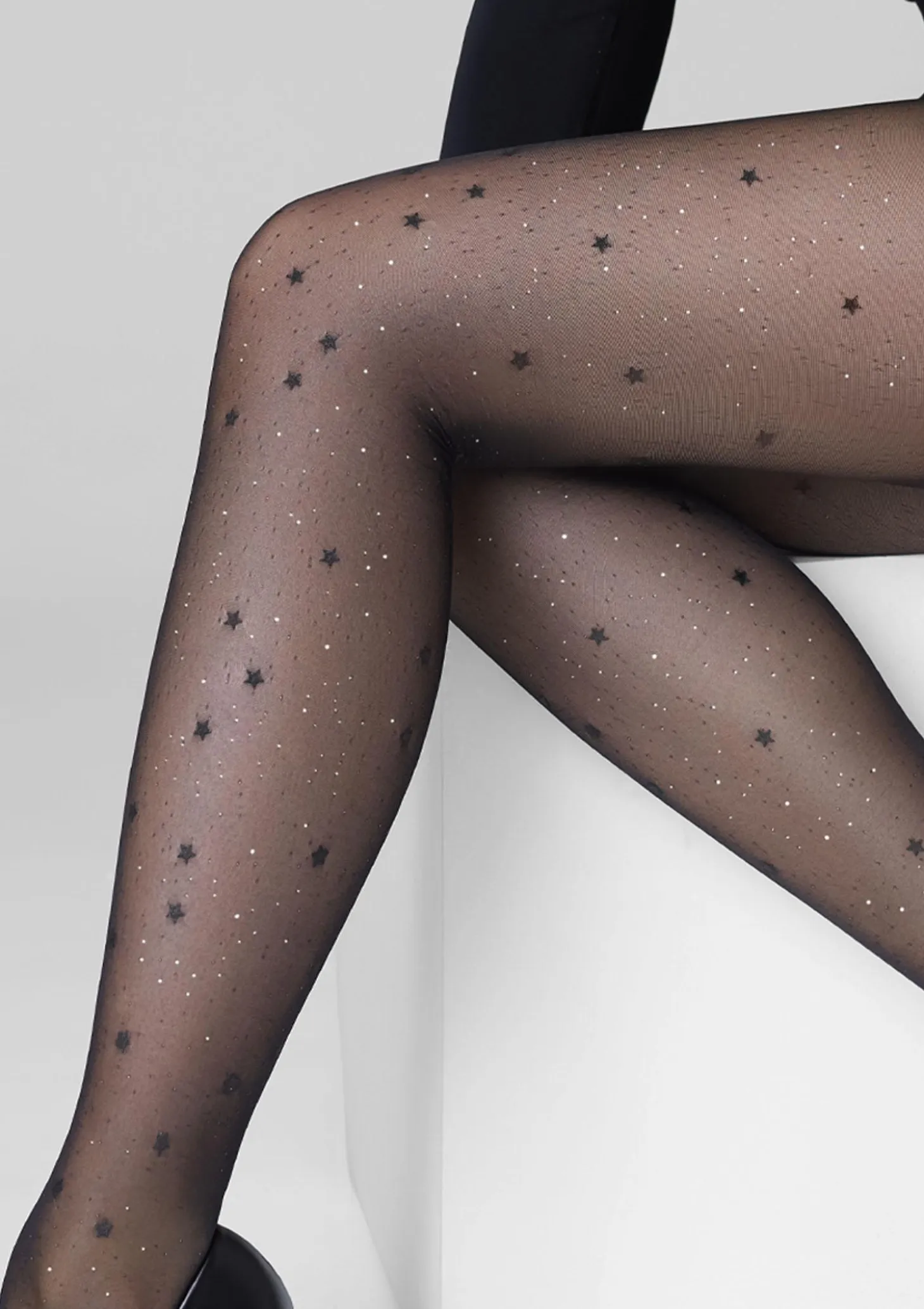 Rajstopy transparentne z brokatem w motyw gwiazdek – Allure F04